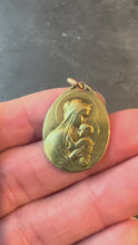 Load and play video in Gallery viewer, Antique French Rasumny Madonna and Child 18K Yellow Gold Religious Medal Pendant
