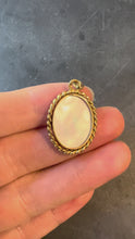 Load and play video in Gallery viewer, French Oval Mother of Pearl Twisted Wire Frame 18K Yellow Gold Charm Pendant
