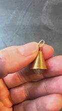 Load and play video in Gallery viewer, bell shaped gold charm with pink stone clapper held in hand
