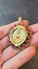 Load and play video in Gallery viewer, Large Augis Plus Qu’Hier Ruby Halo 18K Yellow Gold Love Medal Pendant
