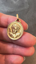 Load and play video in Gallery viewer, French Grun Raphael’s Cherub 18K Yellow Gold Medal Pendant

